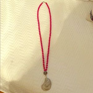 Hot pink beaded necklace with oyster pendant
